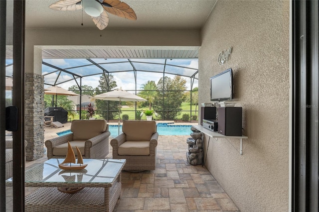 view of patio with a lanai, a grill, and ceiling fan