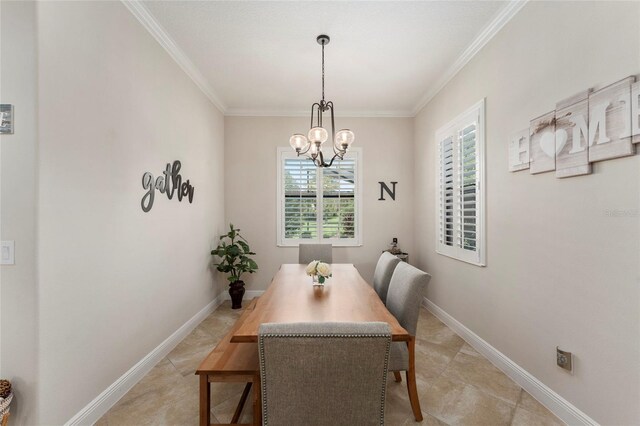 dining area with an inviting chandelier and ornamental molding