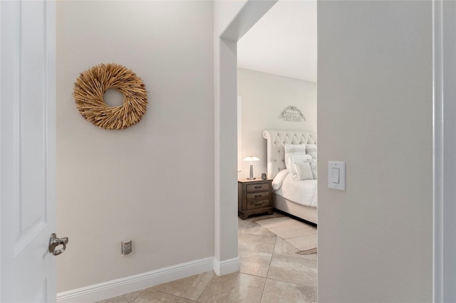 hallway with light tile patterned flooring