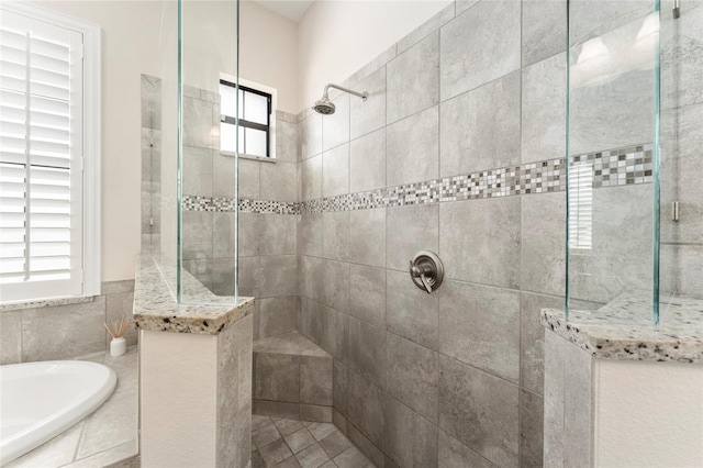 bathroom with separate shower and tub