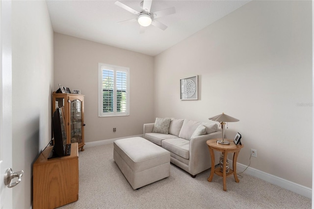 living room with ceiling fan and light colored carpet