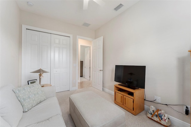 living room featuring ceiling fan and light carpet