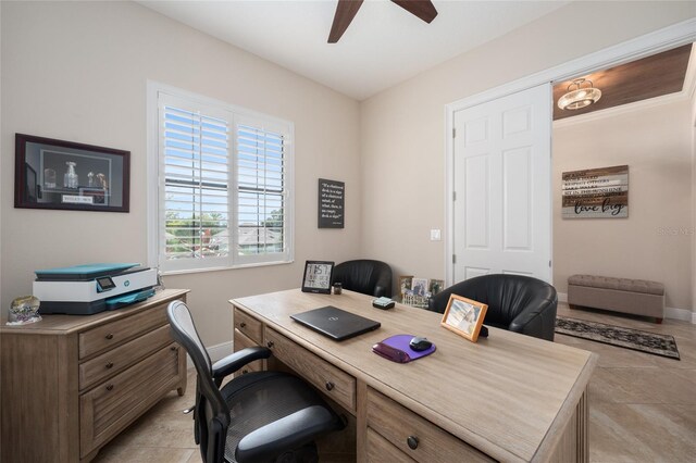 tiled office featuring ceiling fan