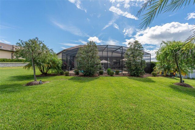 view of yard with a lanai