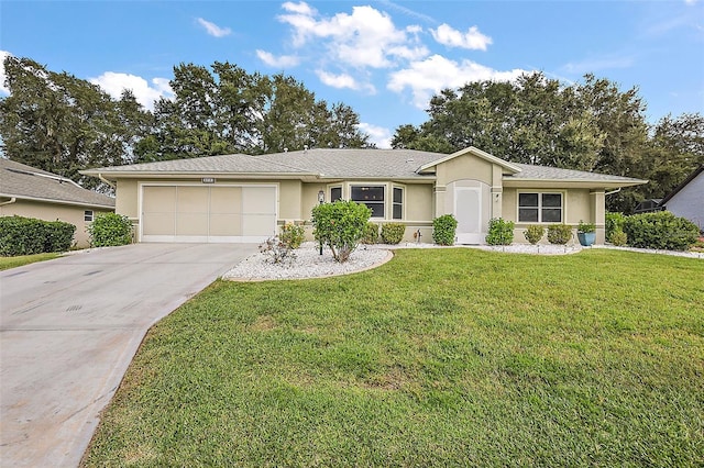 single story home featuring a garage and a front lawn