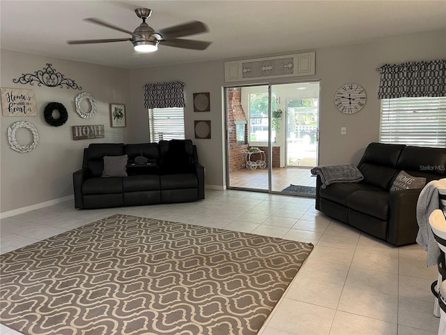 tiled living room with ceiling fan