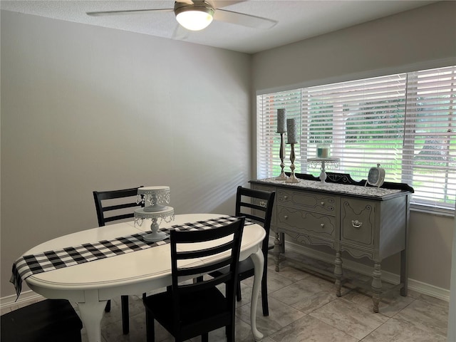 dining area with ceiling fan