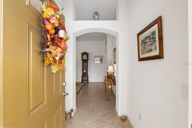 hallway featuring light tile patterned flooring