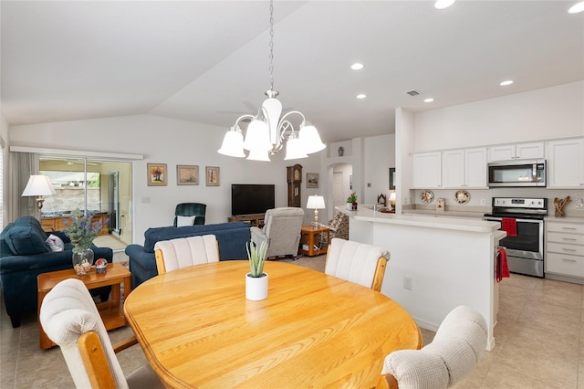 dining area with light tile patterned floors, vaulted ceiling, and a chandelier