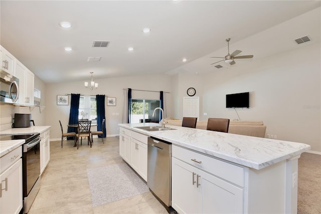 kitchen featuring appliances with stainless steel finishes, ceiling fan with notable chandelier, lofted ceiling, and sink