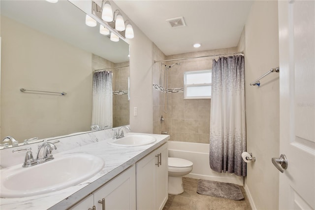 full bathroom featuring vanity, toilet, tile patterned floors, and shower / bath combination with curtain