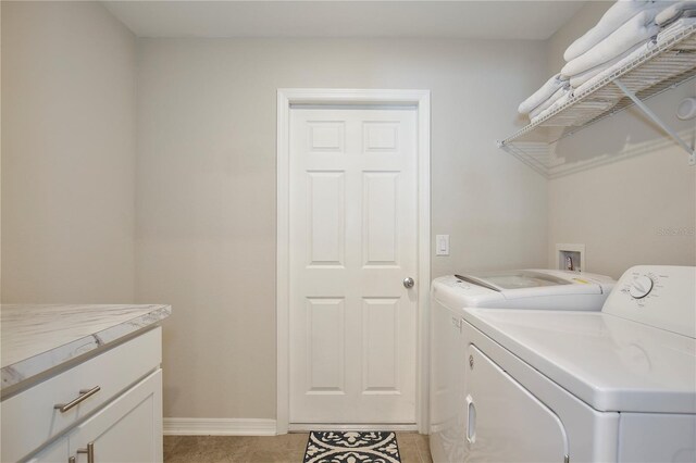 laundry area featuring light tile patterned flooring and independent washer and dryer