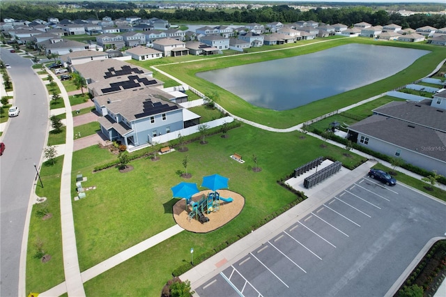 birds eye view of property with a water view