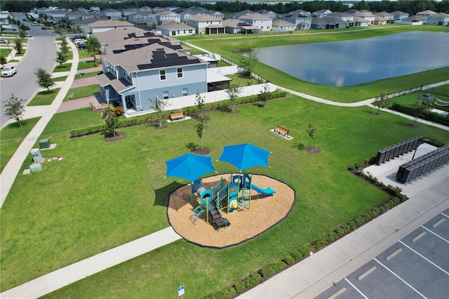 birds eye view of property with a water view