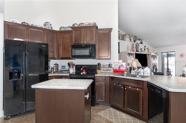 kitchen featuring dark brown cabinets, a center island, sink, lofted ceiling, and black appliances