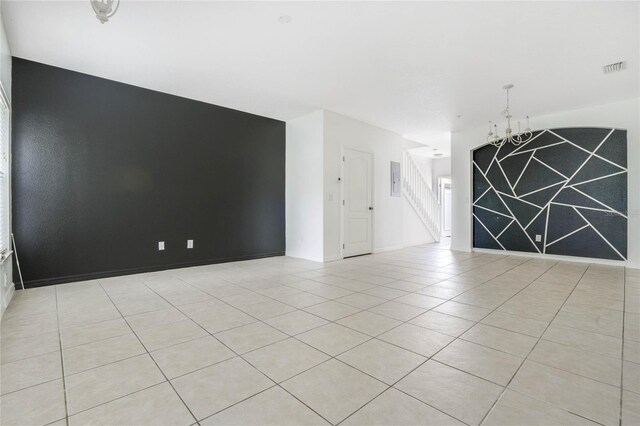 unfurnished room featuring light tile patterned floors