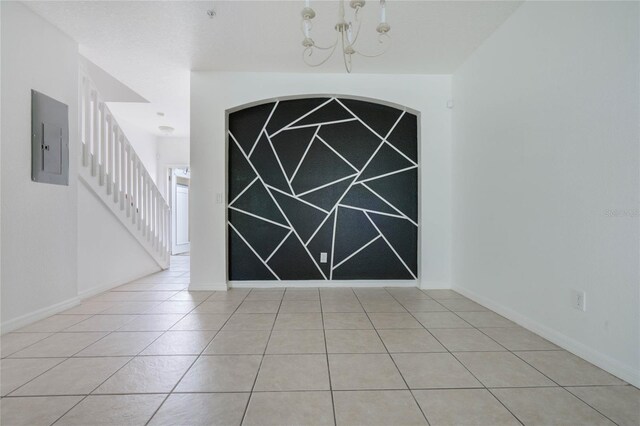 interior space with an inviting chandelier and electric panel