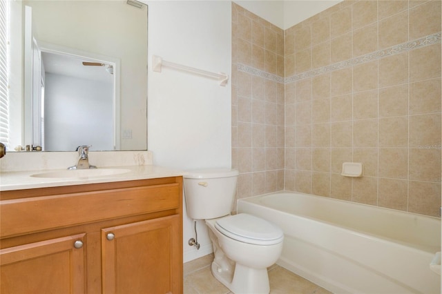 full bathroom with vanity, toilet, tiled shower / bath combo, and tile patterned floors