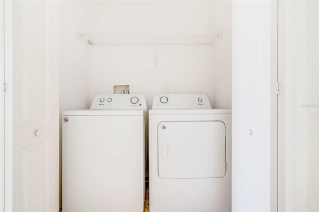 laundry room with washer and clothes dryer