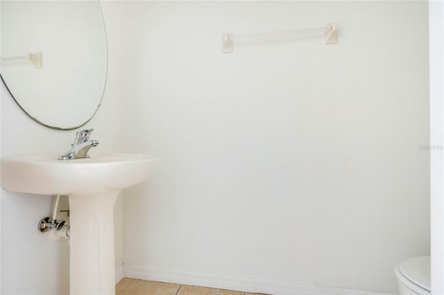 bathroom featuring toilet and tile patterned floors