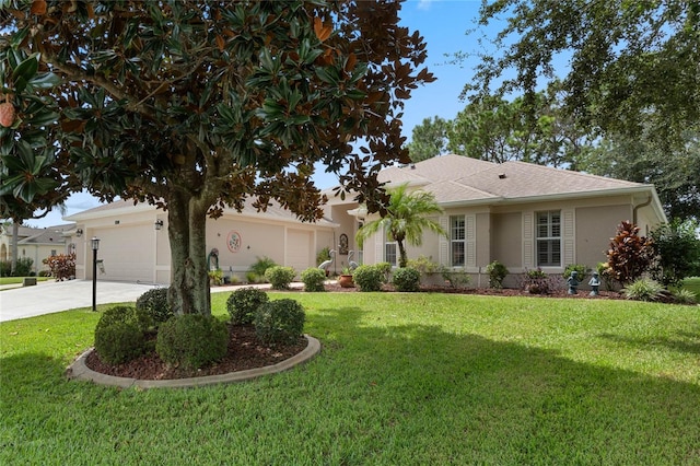 single story home with a garage and a front lawn