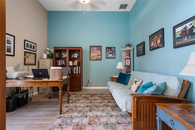 office featuring ceiling fan and hardwood / wood-style flooring