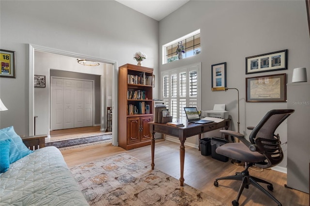 office area with light hardwood / wood-style floors