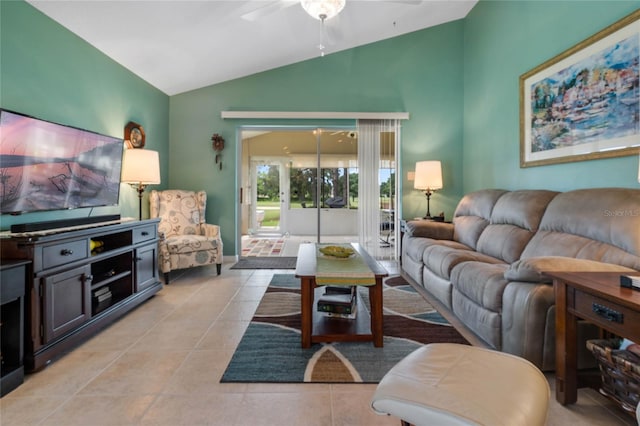 living room featuring ceiling fan, light tile patterned flooring, and vaulted ceiling