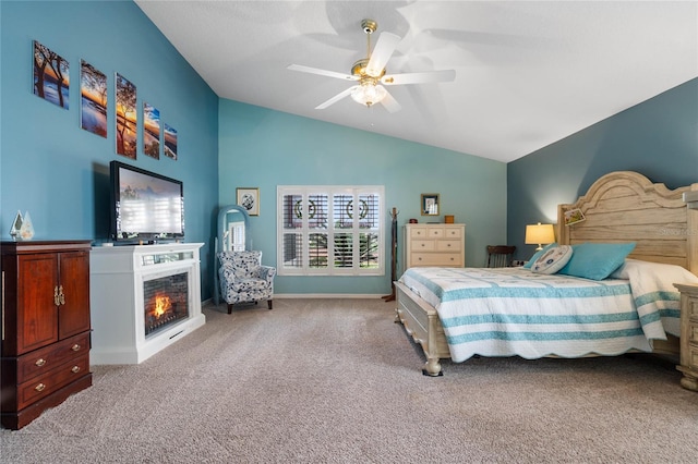 bedroom with lofted ceiling, ceiling fan, and carpet floors