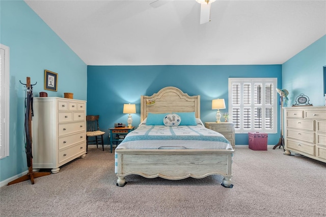 bedroom featuring lofted ceiling, ceiling fan, and carpet floors