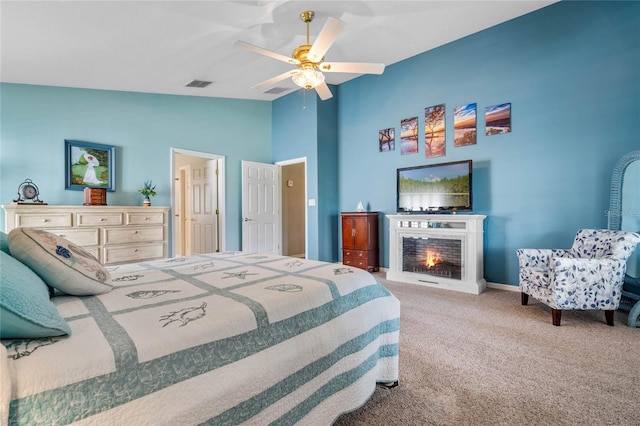 bedroom with lofted ceiling, carpet, and ceiling fan