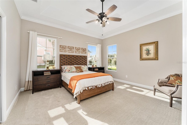 carpeted bedroom with ceiling fan and crown molding