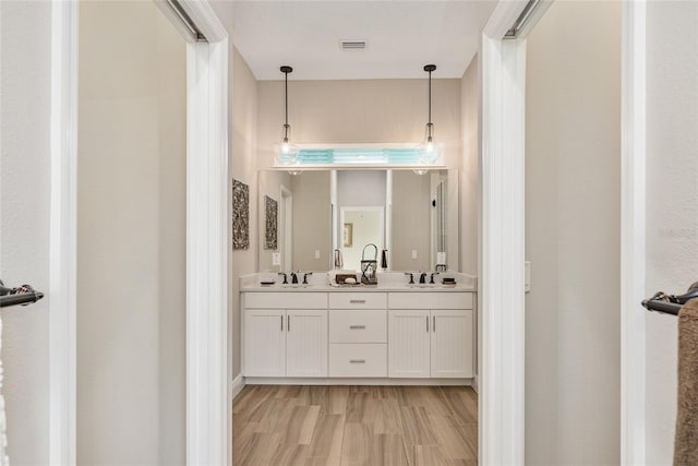 bathroom with vanity and hardwood / wood-style floors