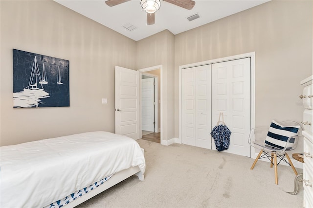 bedroom with carpet flooring, ceiling fan, and a closet