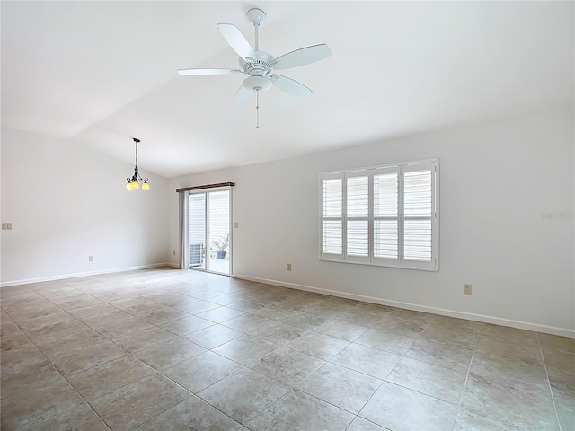 tiled spare room featuring ceiling fan with notable chandelier and vaulted ceiling