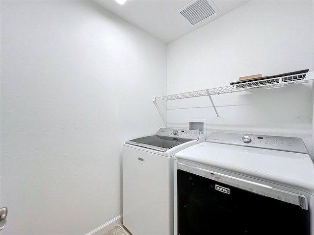 washroom with separate washer and dryer