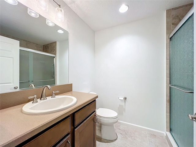 bathroom featuring tile patterned flooring, a shower with door, toilet, vanity, and a textured ceiling