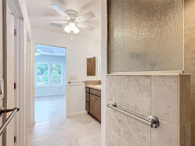 bathroom with tile patterned floors, ceiling fan, and vanity