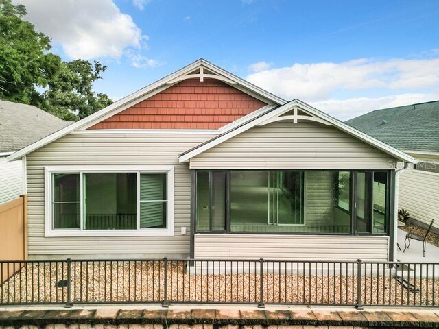 view of front of house featuring a sunroom