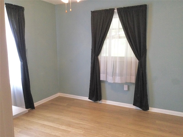 unfurnished room with light hardwood / wood-style flooring