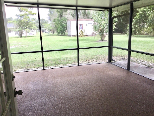 unfurnished sunroom featuring a wealth of natural light