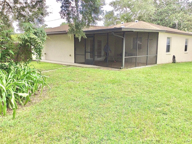 view of yard with a sunroom