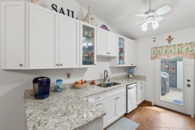 kitchen with ceiling fan, sink, a textured ceiling, white cabinetry, and dishwasher