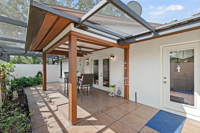 view of patio featuring ceiling fan and french doors