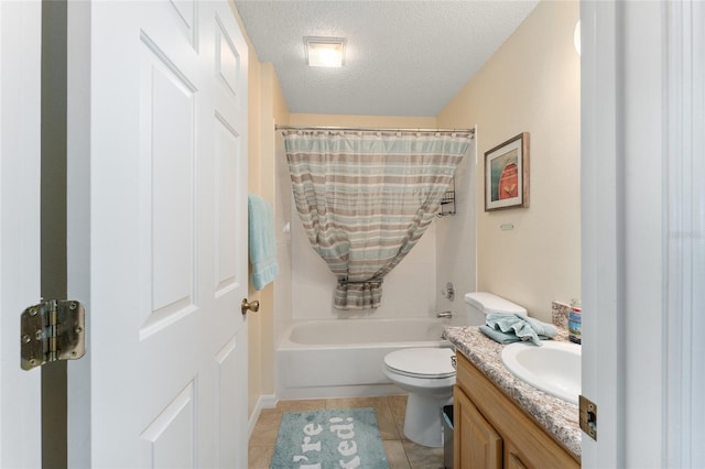 full bathroom with toilet, tile patterned flooring, vanity, a textured ceiling, and shower / tub combo with curtain