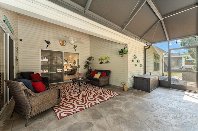 sunroom / solarium featuring ceiling fan