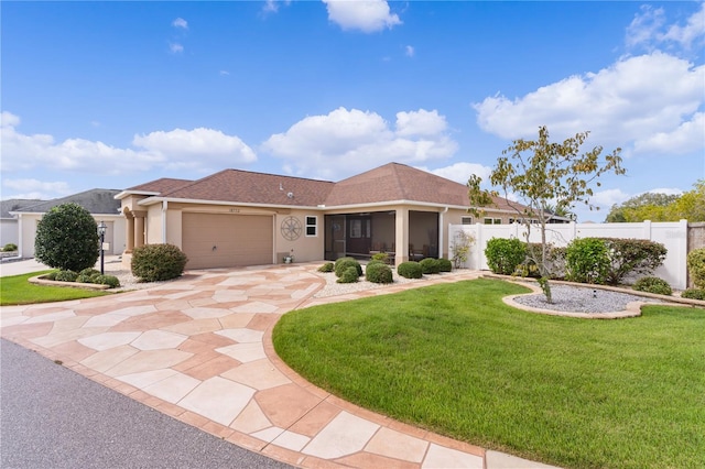 view of front of property with a garage and a front yard