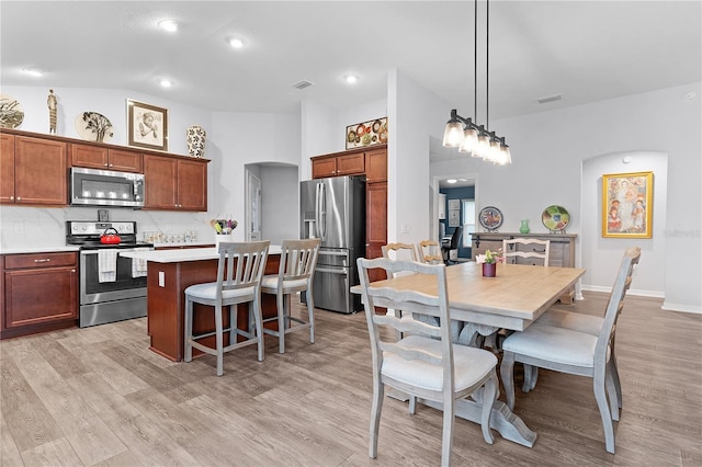 interior space featuring light hardwood / wood-style flooring and lofted ceiling