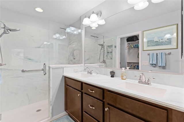 bathroom featuring vanity and an enclosed shower