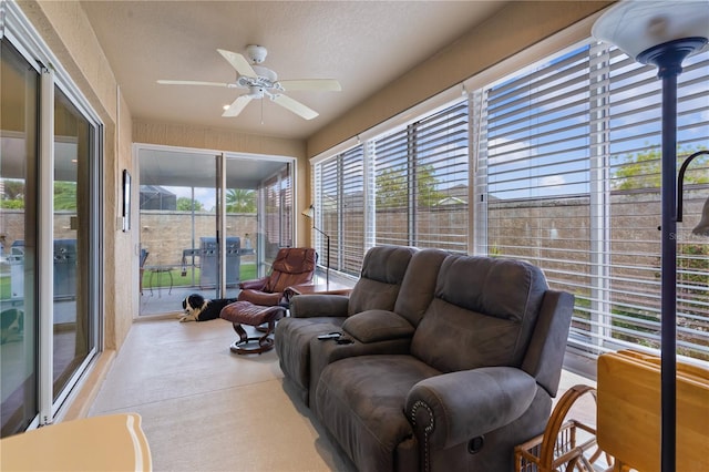 sunroom featuring ceiling fan